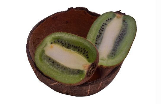Fresh kiwi in coconut shell on white background.