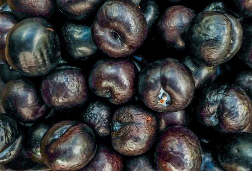 Many ripe plums sold sold in the market Suitable for making background images.