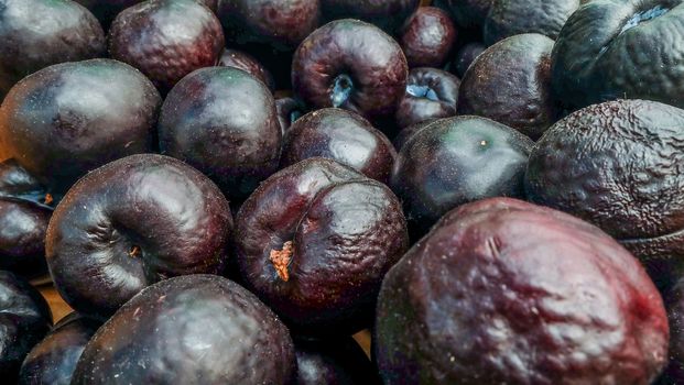 Many ripe plums sold sold in the market Suitable for making background images.