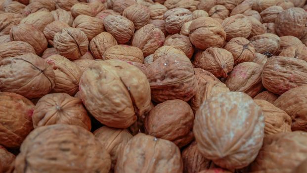 Bunch of whole walnuts. Healthy diet composition Suitable for making background images.