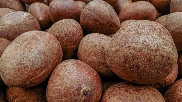 Pile of coconuts in the food market of India Suitable for making background images.