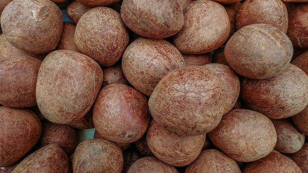 Pile of coconuts in the food market of India Suitable for making background images.