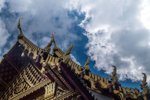 The roof of the Thai temple, along with the gable at the top of the church with a sky backdrop Suitable for making background images.