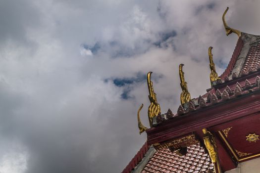 The roof of the Thai temple, along with the gable at the top of the church with a sky backdrop Suitable for making background images.