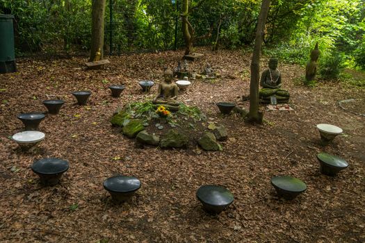 Buddha statue located in the forest park Shady and quiet Suitable for meditation.