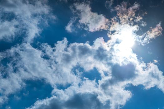 Sunbeam through the haze on blue sky , clouds with sun rays Suitable for making background images.