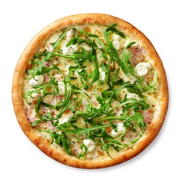 Light creamy pizza with ham slices under layer of browned melted mozzarella topped with cream cheese mixed with spicy herbs and fresh fragrant arugula leaves, top view isolated on white background