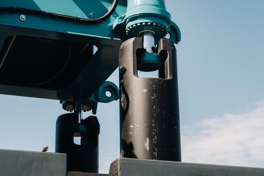 installing a counterweight on a truck crane. detail of the truck crane.Autoparts