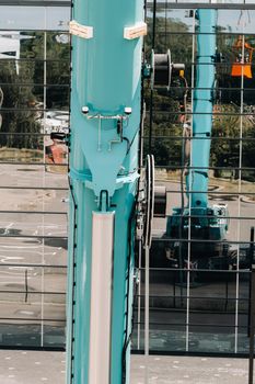 Hydraulic cylinder of the lifting system on a car crane.The control system of the crane engine.Lifting the hydraulic compartment on a truck crane