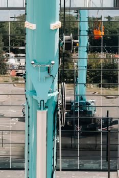 Hydraulic cylinder of the lifting system on a car crane.The control system of the crane engine.Lifting the hydraulic compartment on a truck crane