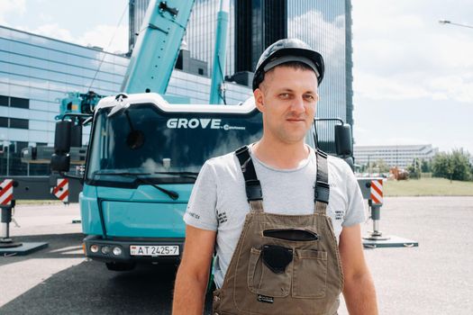 July 30, 2020. Minsk, Belarus.A driver next to a large modern car crane in the city of Minsk.