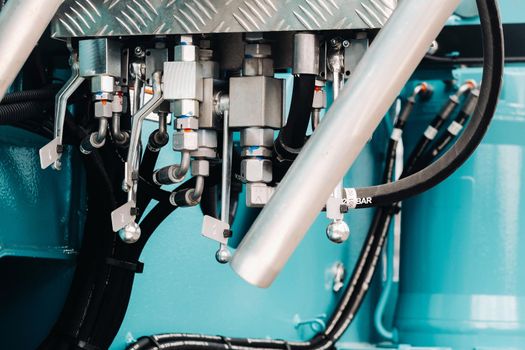 Hydraulic crane engine.The control system of the crane engine.Lifting hydraulic Department on the truck crane.The hydraulic system of the engine.hydraulic hoses on the crane.autoparts.