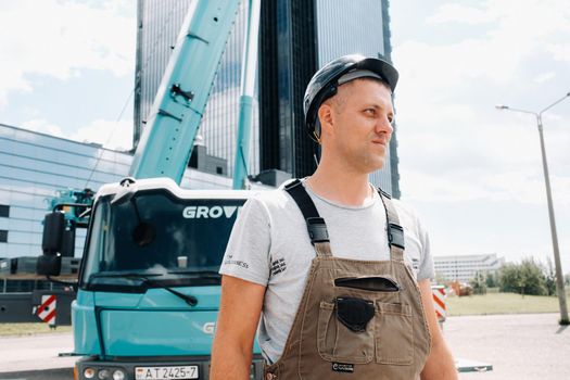 July 30, 2020. Minsk, Belarus.A driver next to a large modern car crane in the city of Minsk.