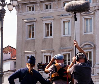 Behind the scene. Film crew team filming movie scene on outdoor location