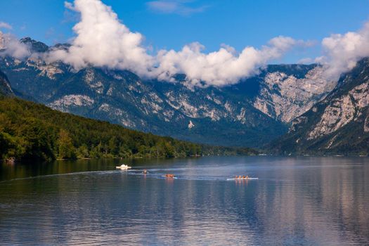 People kayaking in the Bohinj lake, Slovenia