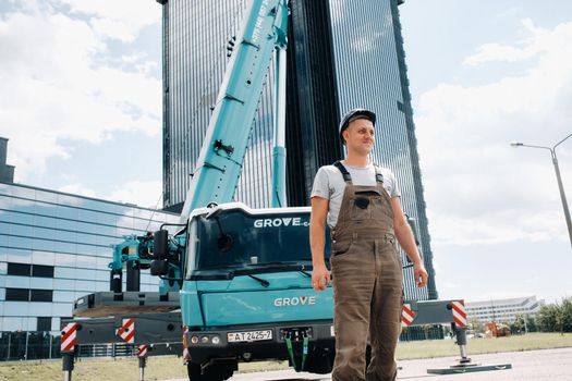 July 30, 2020. Minsk, Belarus.A driver next to a large modern car crane in the city of Minsk.