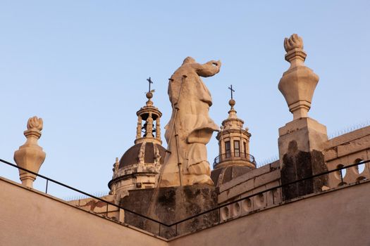 Top view of St. Agata church of Catania from the Badia church at sunset