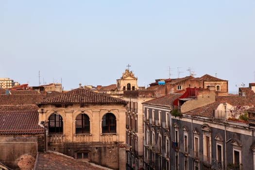 Top view of Catania baroque buildings from the Badia church at sunset
