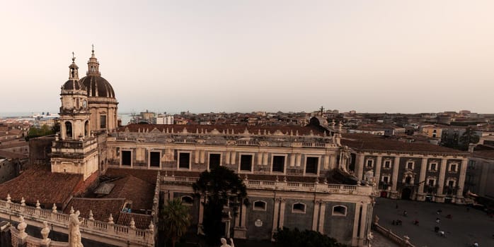 Top view of St. Agata church of Catania from the Badia church at sunset