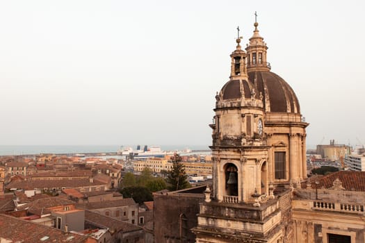 Top view of St. Agata church of Catania from the Badia church at sunset