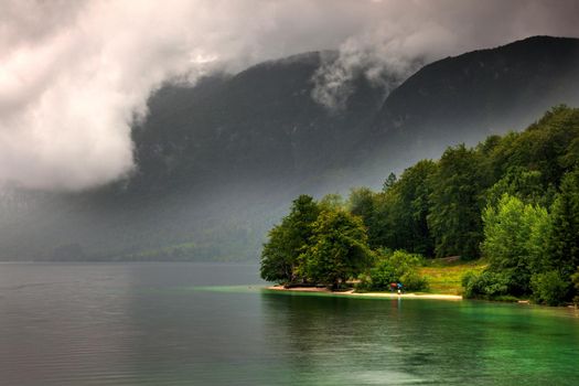 View of scenic Bohinj lake, the largest permanent lake in Slovenia, located within the Bohinj Valley of the Julian Alps