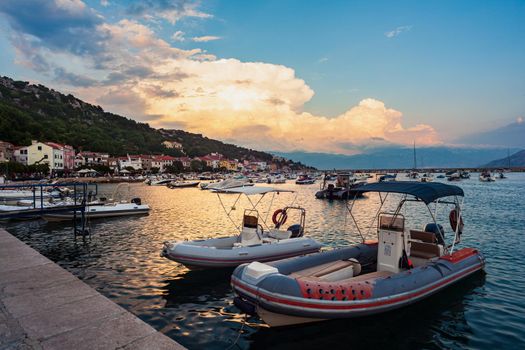 View of moored Boats at sunset in the Baska town, krk. Croatia