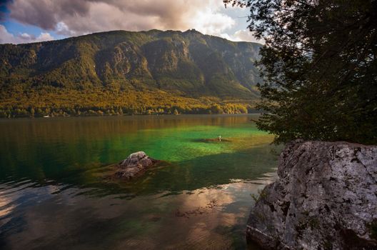 View of scenic Bohinj lake, the largest permanent lake in Slovenia, located within the Bohinj Valley of the Julian Alps