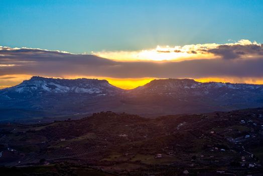 View of Enna and Calascibetta skyline at sunset in the december season