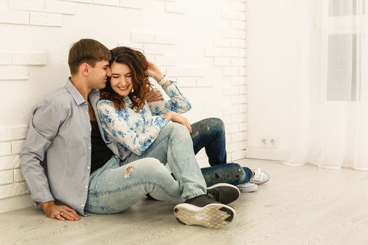 repair, building, renovation and home concept - smiling couple looking at tablet pc at home