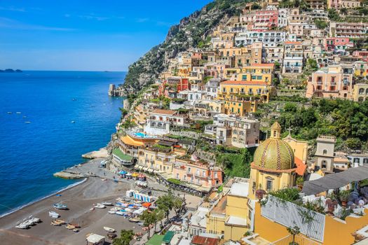 Idyllic Positano city cliffs and marina with boats and yacht, amalfi coast, Italy