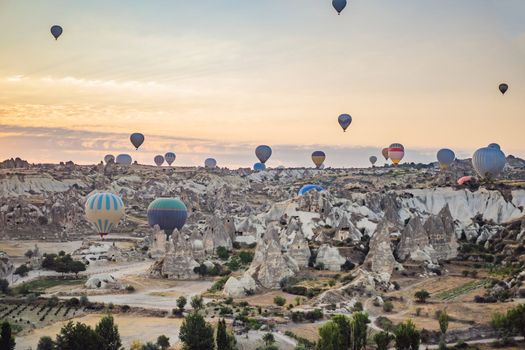 Colorful hot air balloon flying over Cappadocia, Turkey.