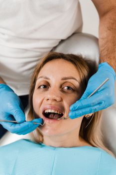 Cheerful girl smiling at dentists consultation in dentistry. Dental diseases. Consultation with dentist for treatment of toothache