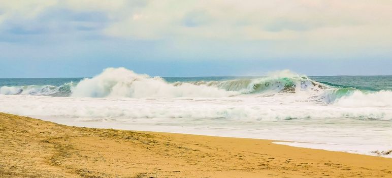 Beach and seascape shore with beautiful huge big surfer waves in Zicatela Puerto Escondido Oaxaca Mexico.