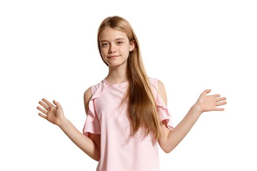 Studio portrait of a lovely blonde young lady in a pink t-shirt isolated on white background in various poses. She expresses different emotions posing right in front of the camera, smiling and greeting someone.