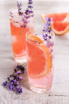 A cocktail of grapefruit and lavender paired with tequila, full of bright citrus aromas and fragrant herbs, showcasing the best fruits of the season.