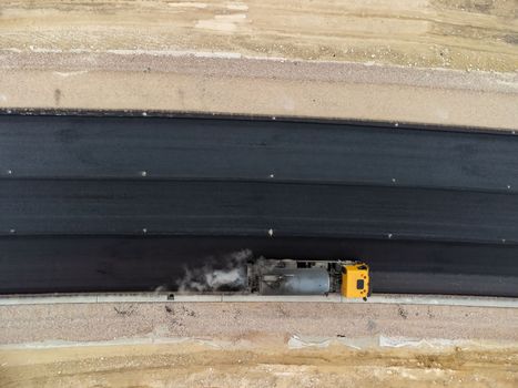 Aerial drone shot Road construction in progress in wild nature canyon.