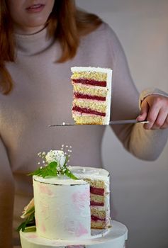 festive wedding two-tiered cake decorated with fresh flowers