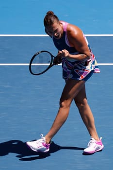 MELBOURNE, AUSTRALIA - JANUARY 23: Aryna Sabalenka of Belarus ce;ebrates beating Belinda Bencic of Switzerland on day 8 of the 2023 Australian Open at Melbourne Park on January 23, 2023 in Melbourne, Australia.