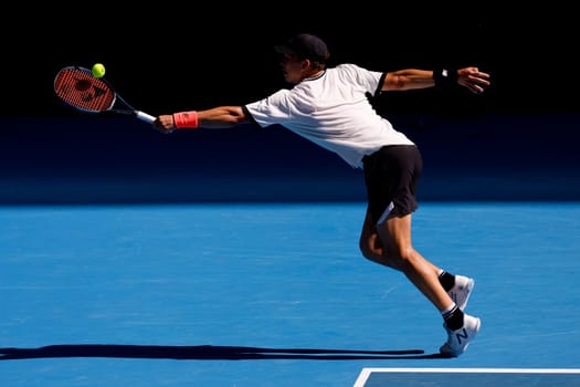 MELBOURNE, AUSTRALIA - JANUARY 23: Ben Shelton of USA plays J.J. Wolf of USA in the 4th round on day 8 of the 2023 Australian Open at Melbourne Park on January 23, 2023 in Melbourne, Australia.