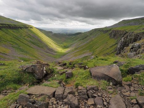 Dramatic view from the edge of High Cup Nick down the High Cup Gill chasm, Eden Valley, North Pennines, Cumbria, UK