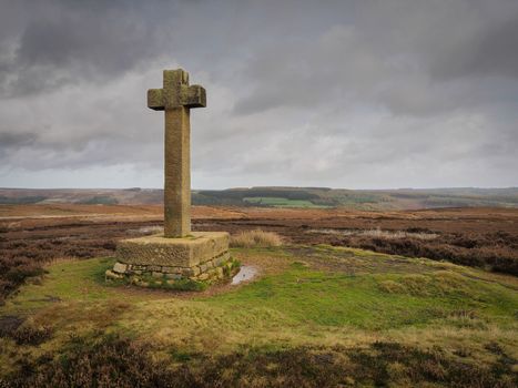 Ana Cross, an ancient stone monument marking the way, stands on top of Spaunton Moor overlooking the Rosedale valley, North York Moors National Park, UK