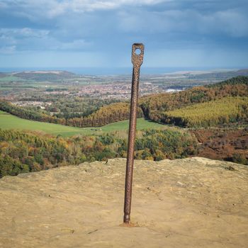 View from the summit of Roseberry Topping, Yorkshires Matterhorn, and a relic of the jet and ironstone mining that took place here, overlooking Guisborough, North York Moors National Park, UK
