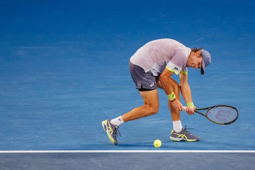 MELBOURNE, AUSTRALIA - JANUARY 23: Alex de Minaur of Australia plays Novak Djokovic of Serbia in the 4th round on day 8 of the 2023 Australian Open at Melbourne Park on January 23, 2023 in Melbourne, Australia.