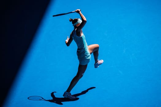 MELBOURNE, AUSTRALIA - JANUARY 23: Magda Linette of Poland plays Caroline Garcia of France on day 8 action of the 2023 Australian Open at Melbourne Park on January 23, 2023 in Melbourne, Australia.