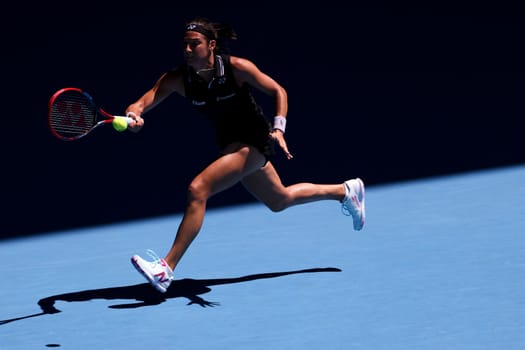 MELBOURNE, AUSTRALIA - JANUARY 23: Caroline Garcia of France plays against Magda Linette of Poland on day 8 action of the 2023 Australian Open at Melbourne Park on January 23, 2023 in Melbourne, Australia.