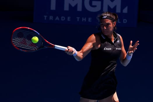 MELBOURNE, AUSTRALIA - JANUARY 23: Caroline Garcia of France plays against Magda Linette of Poland on day 8 action of the 2023 Australian Open at Melbourne Park on January 23, 2023 in Melbourne, Australia.