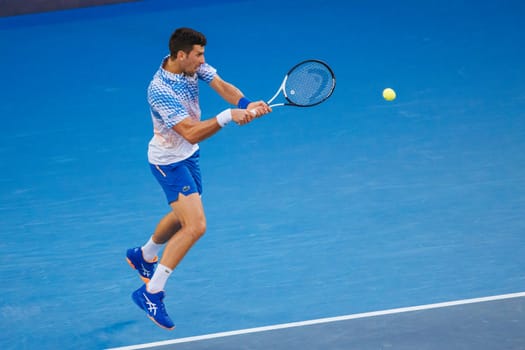 MELBOURNE, AUSTRALIA - JANUARY 23: Novak Djokovic of Serbia plays Alex de Minaur of Australia in the 4th round on day 8 of the 2023 Australian Open at Melbourne Park on January 23, 2023 in Melbourne, Australia.