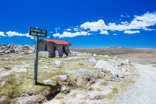 The historic Seamans Hut in Kosciuszko National Park between Mt Kosciuszko and Charlotte Pass on a clear summer's day, in the Snowy Mountains, New South Wales, Australia