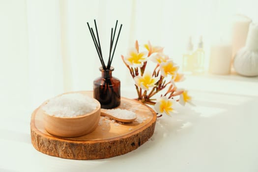 Spa accessory composition set in day spa hotel , beauty wellness center . Spa product are placed in luxury spa resort room , ready for massage therapy from professional service .