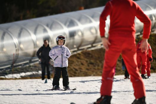 Ski coach giving a lesson on how to ski